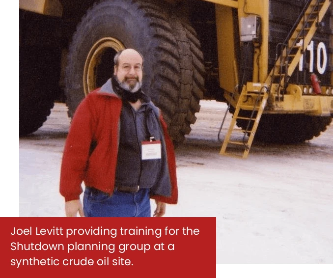 Joel Levitt Standing in front of Truck